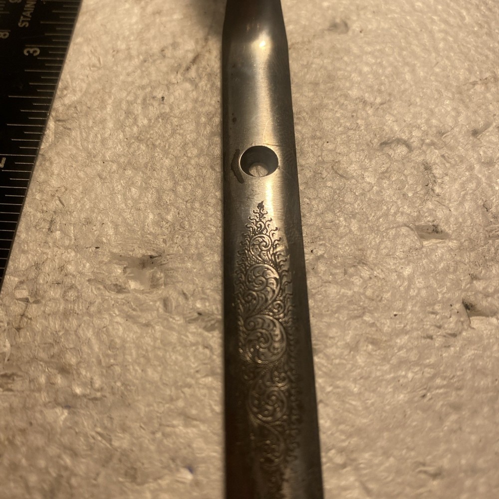 Silver Trigger Guard Of Unknown Brand.