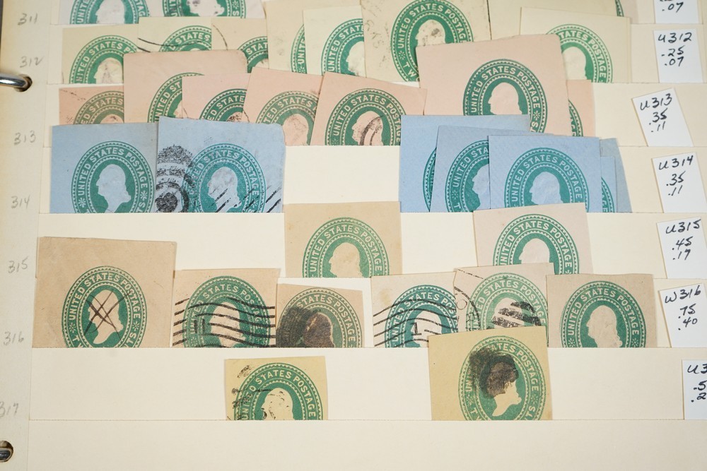 US COLLECTION OF 1,200+ STATIONERY CUT SQUARE STAMPS STORED IN STOCKBOOK