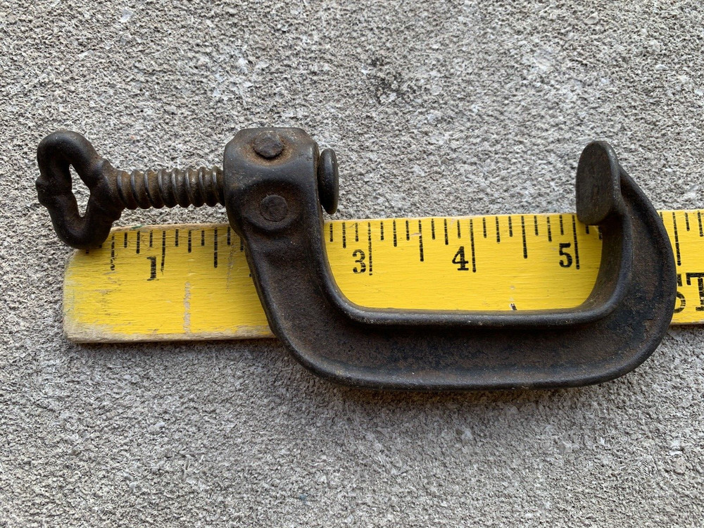 Small iron clamp held together with pins