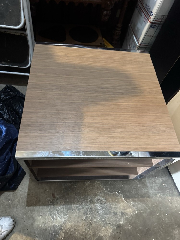 Minimalist side table,consistent with Minotti’s design likely the Hamilton