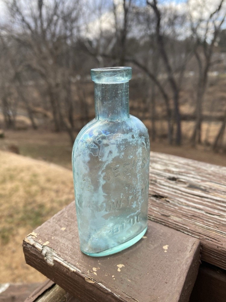 Week’s Snow Flake Blue Antique Bottle