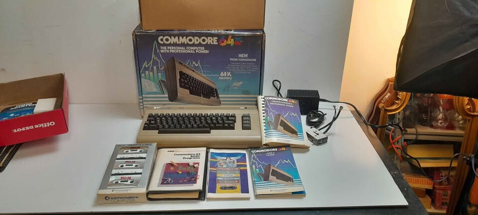 Vintage Commodore 64 computer in box, manuals and programs package