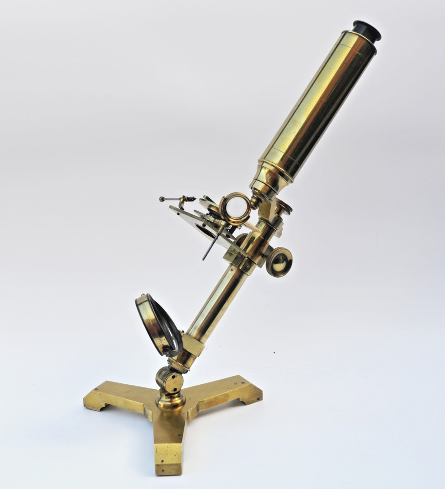 Brass microscope in case.