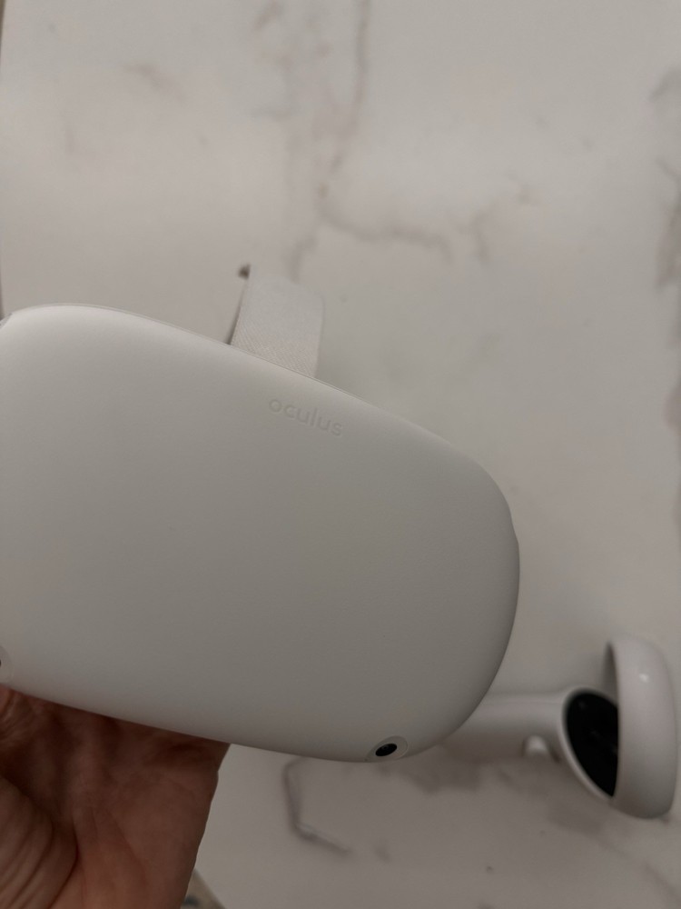 Meta Quest 2 All-In-One VR Headset with its controllers