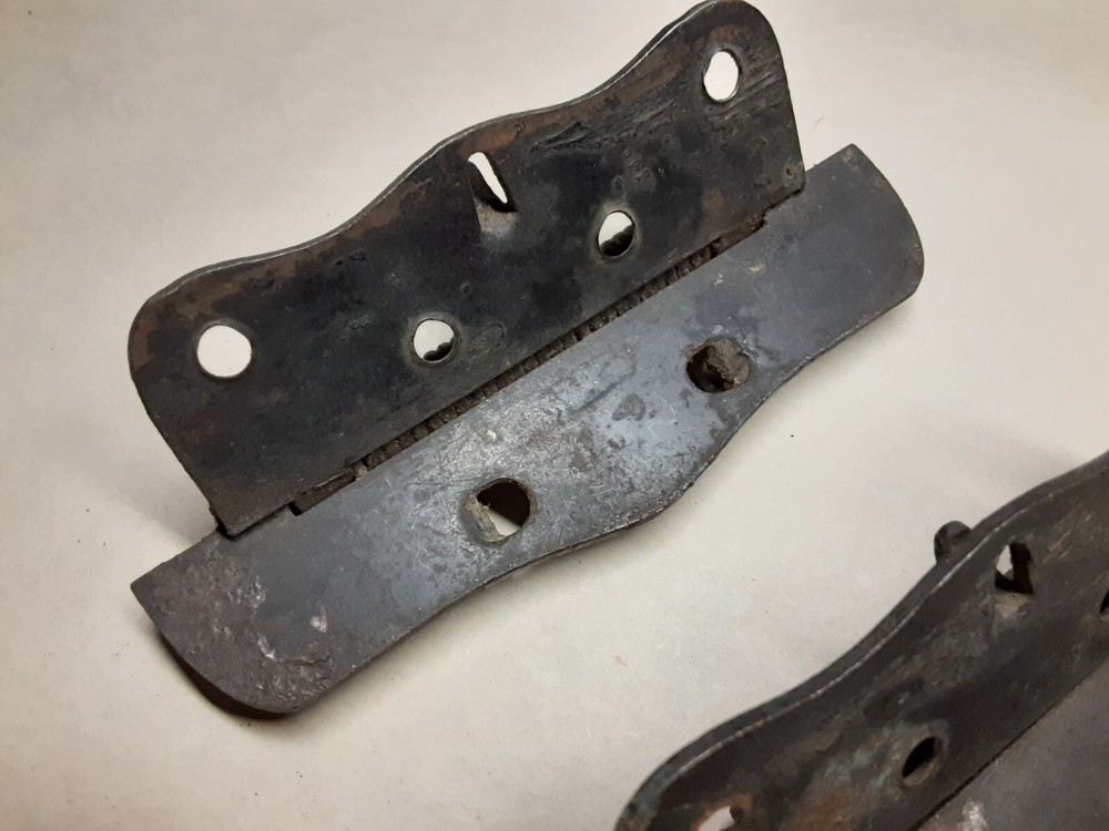 Pair of vintage spring loaded hinges