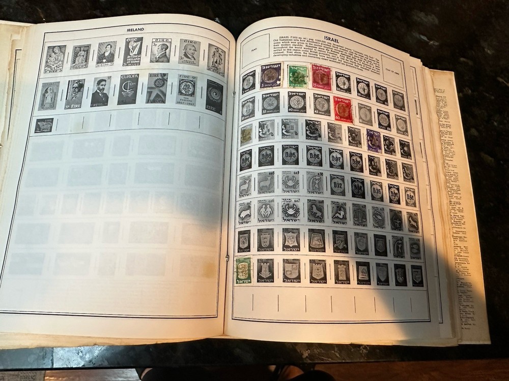 VTG 1977 Traveler Stamp Album With Many Stamps.