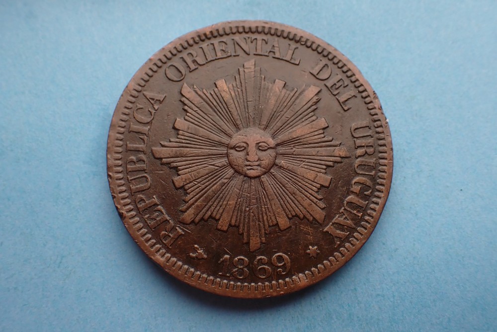 Uruguay, 4 Centesimos 1869 H, as shown.