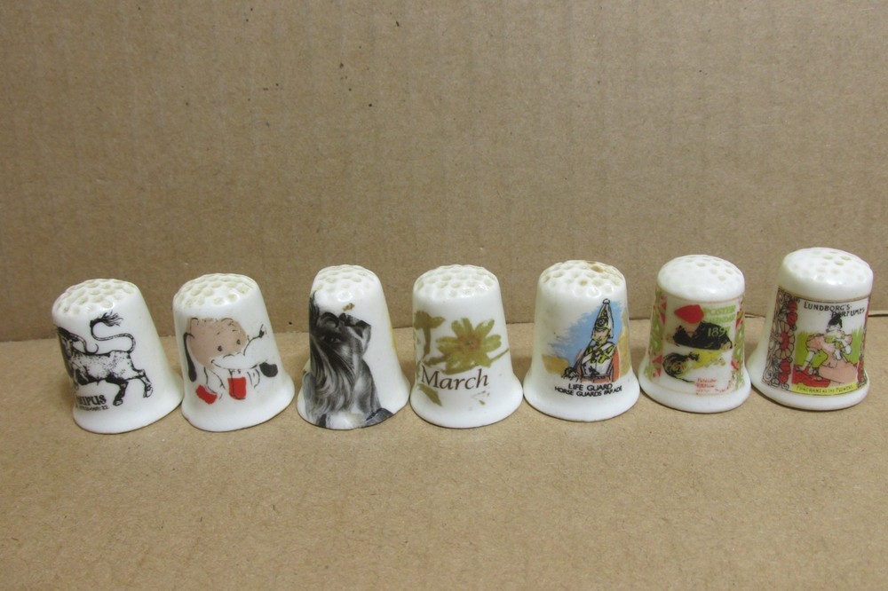 7 VARIOUS PORCELAIN THIMBLES: