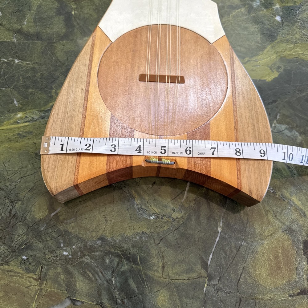8-string Tahitian Ukulele. Model Featuring A Turtle-shaped Body. Used