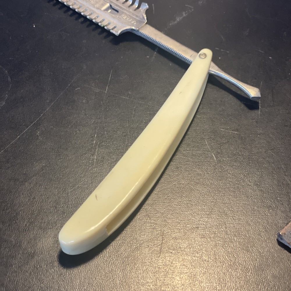 Two vintage straight razors