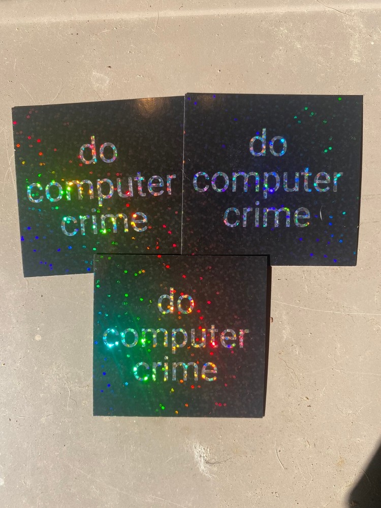 Glitter and holographic 'do computer crime' stickers