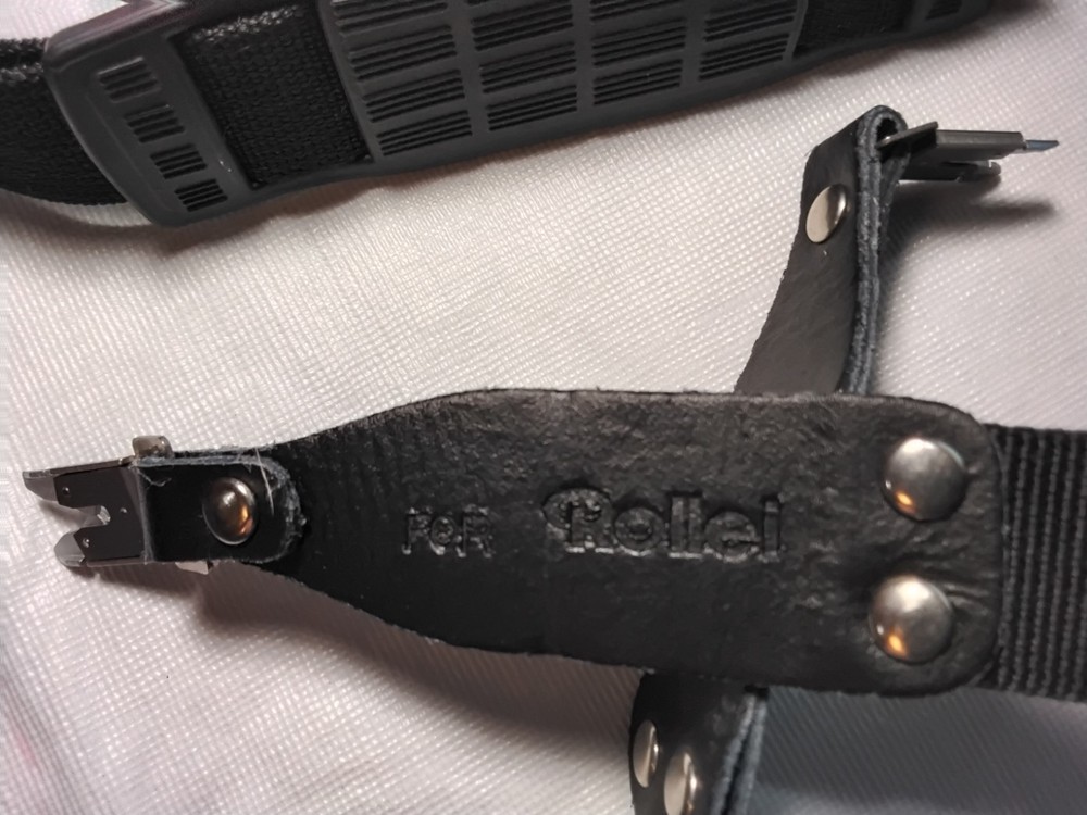 Rollei black nylon neck/shoulder strap. Mint condition