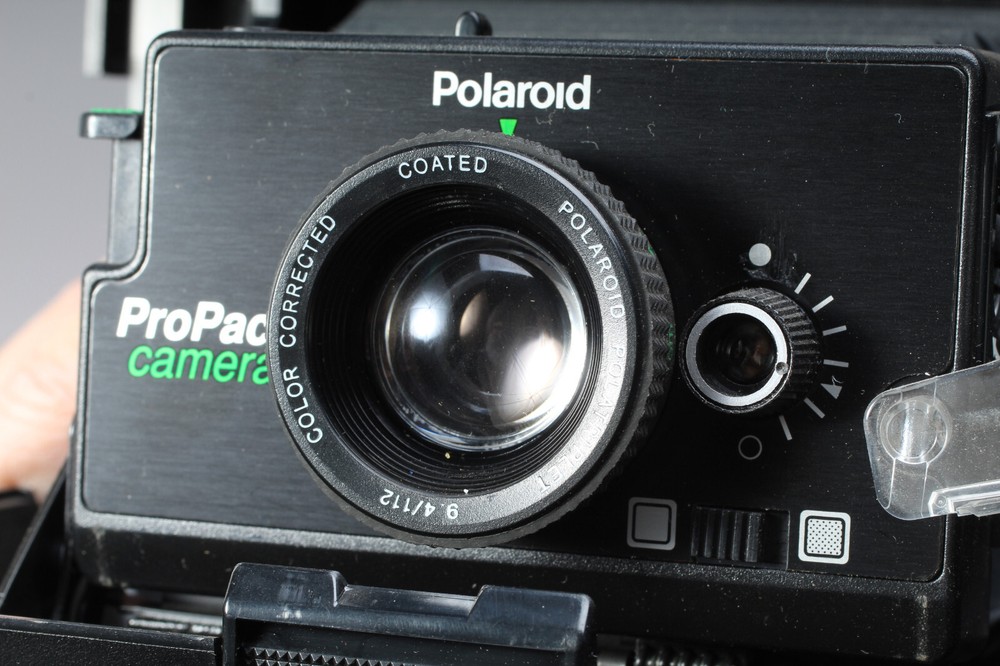 POLAROID PRO-PACK IN THE BOX W CAMERA FLASH STRAP & MANUALS FLASH BAD