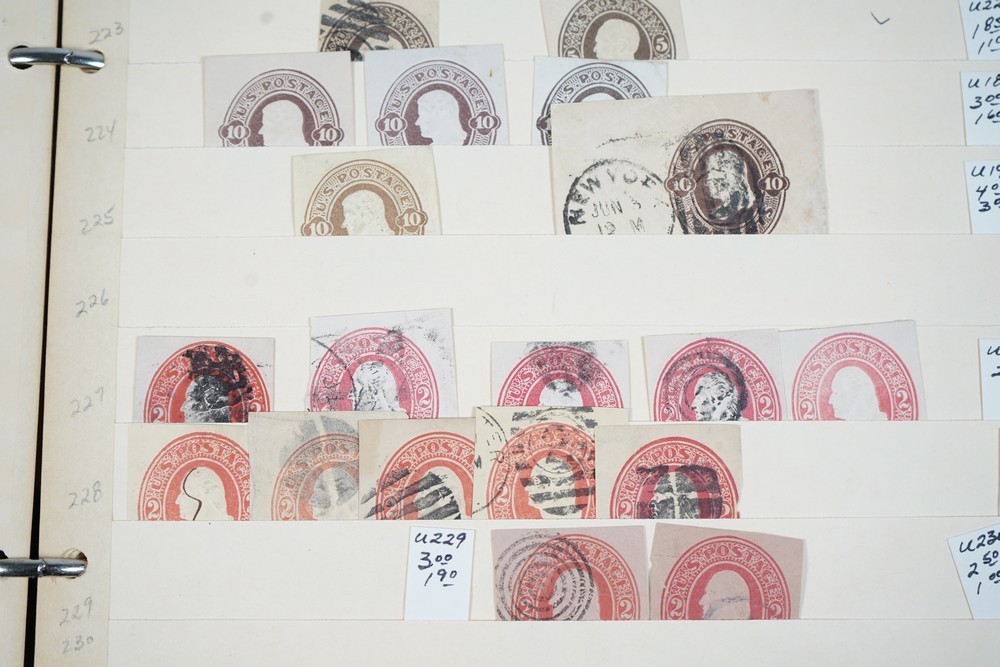 US COLLECTION OF 1,200+ STATIONERY CUT SQUARE STAMPS STORED IN STOCKBOOK