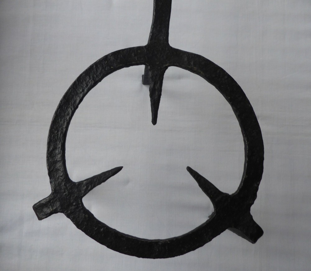 A 18TH CENTURY PRMATIVE FORGED IRON TRIVET