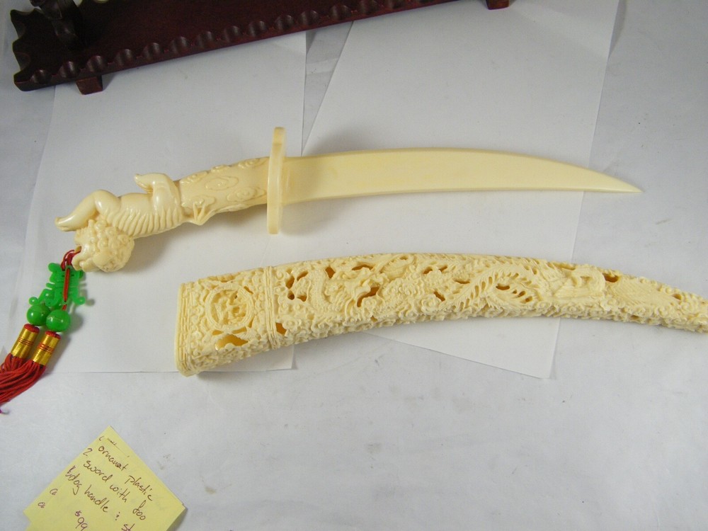 ORNATE PLASTIC SAMURAI SWORD WITH FOO DOG HANDLE AND STAND