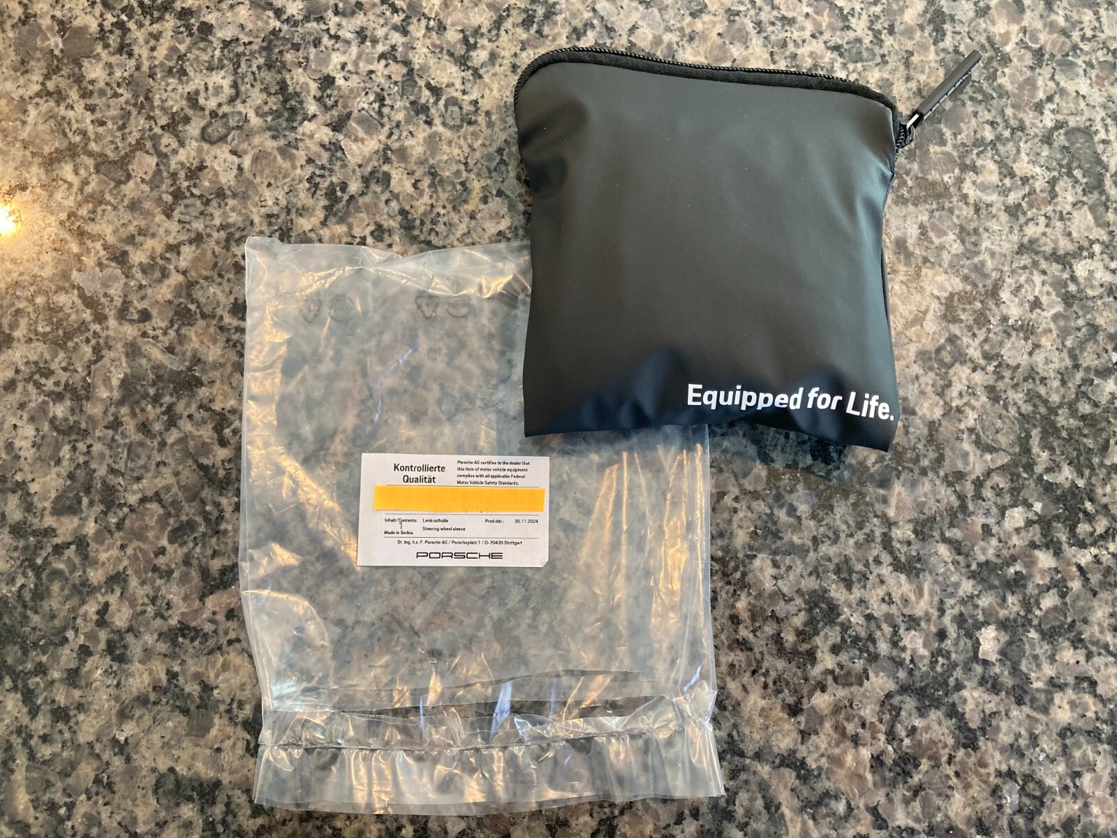 PORSCHE DESIGN OEM FACTORY STEERING WHEEL PROTECTIVE COVER IN BLACK W/CREST. NEW