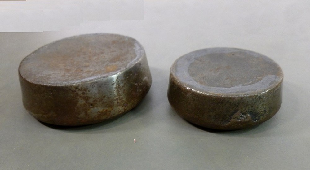 TWO cast iron WEIGHTS trade type SCALE ACCESSORY 1 lb and 8 oz round stacking