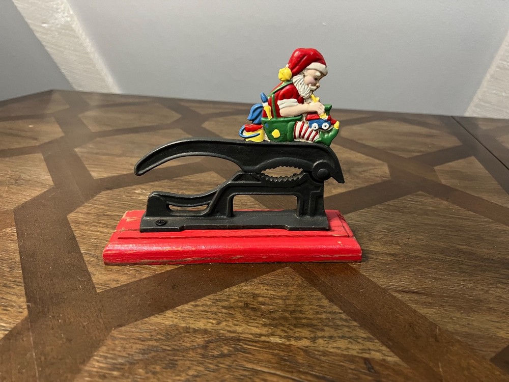Old Fashioned Nutcracker Cast Iron on Wood Base santa theme nutcracker vintage