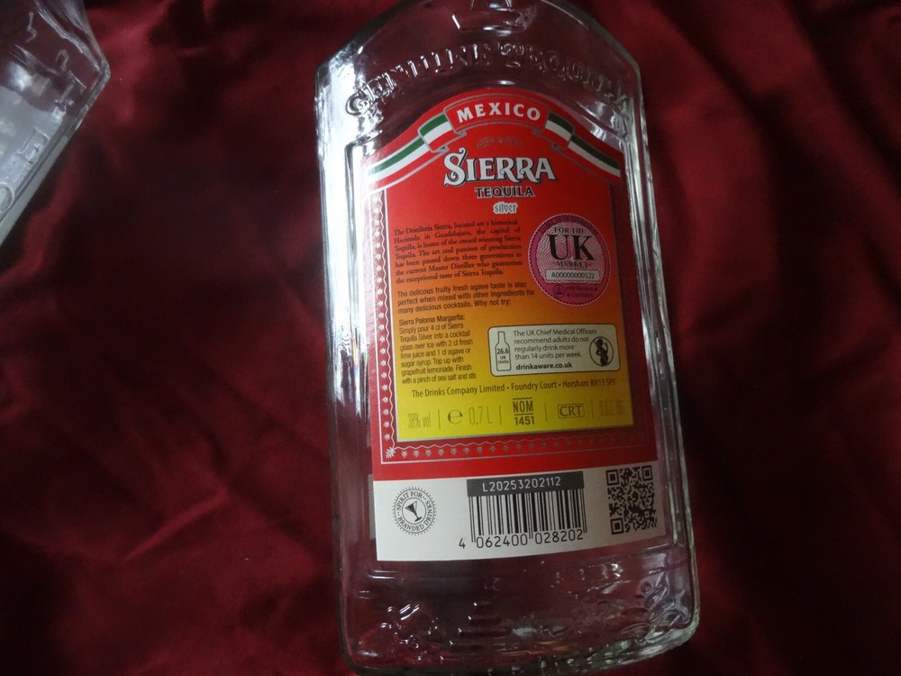 Two empty Sierra Tequila bottles- Blanco and Silver (superb condition)