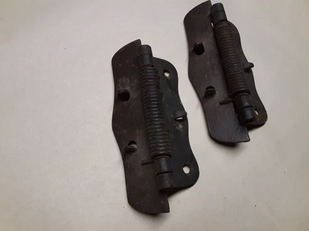 Pair of vintage spring loaded hinges