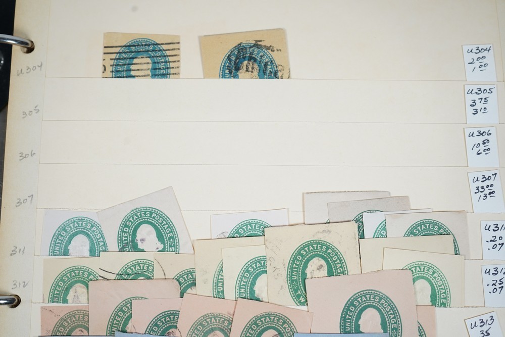 US COLLECTION OF 1,200+ STATIONERY CUT SQUARE STAMPS STORED IN STOCKBOOK