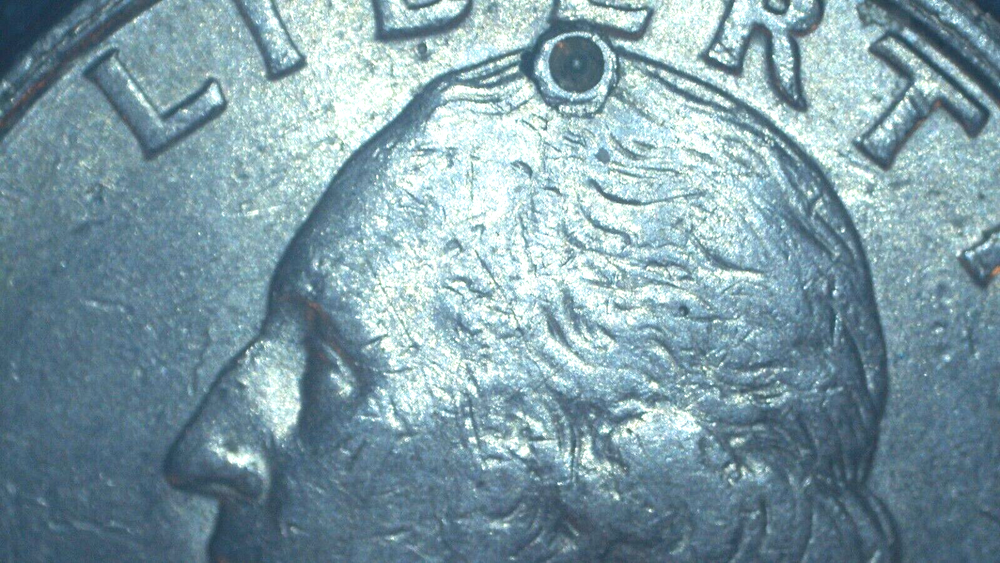 1991 Washington Quarter with a (strike through)