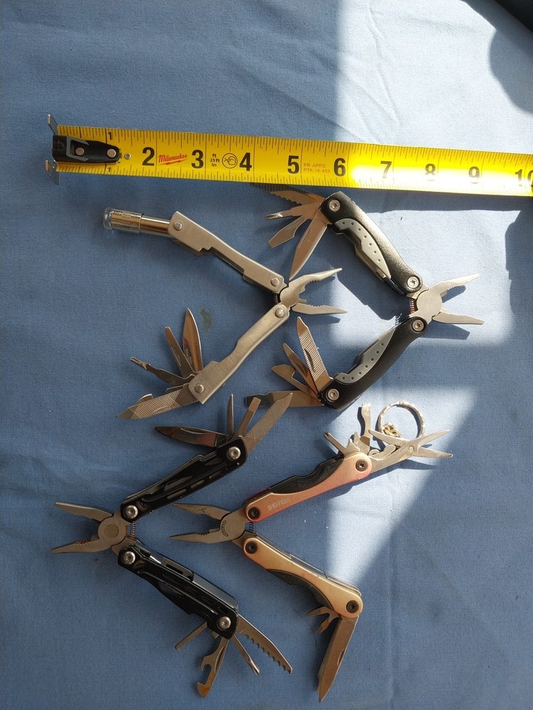 4 small multitudes with pliers knife scissors screwdriver's