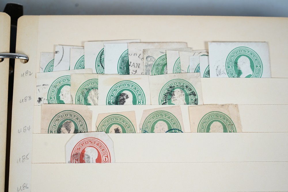 US COLLECTION OF 1,200+ STATIONERY CUT SQUARE STAMPS STORED IN STOCKBOOK