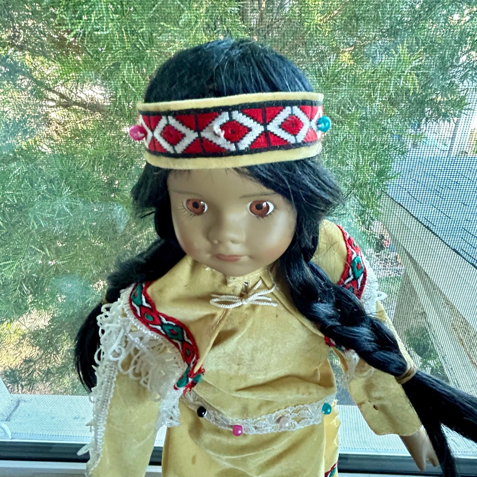 Vintage Porcelain Native American-Inspired Doll with Braids and Beaded Outfit