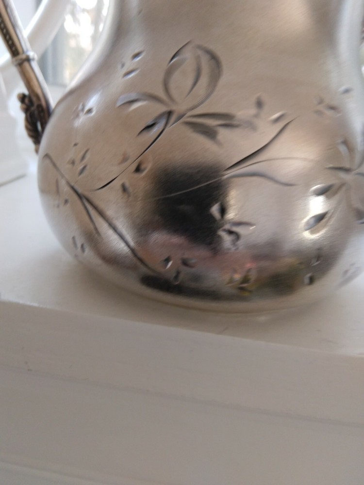 Beautiful small antique silver plated or silver pitcher.