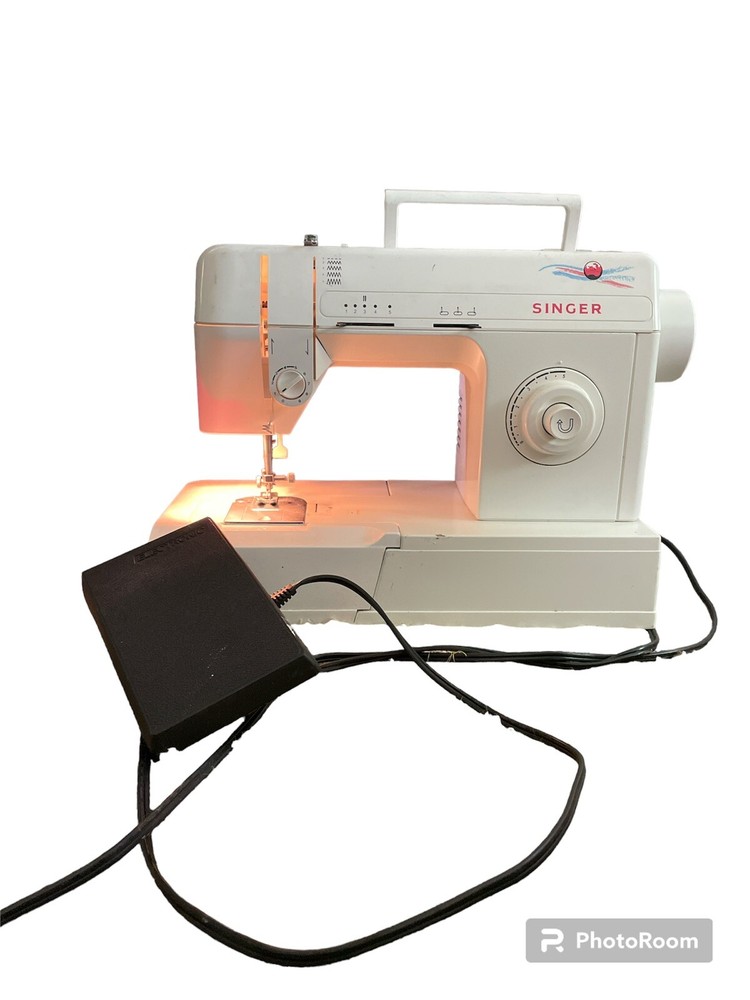 Singer Sewing Machine model 2517C with pedal 130V Tested does work!