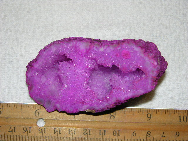 Geode cut & polished half with colored crystal center 3.5 inch E87