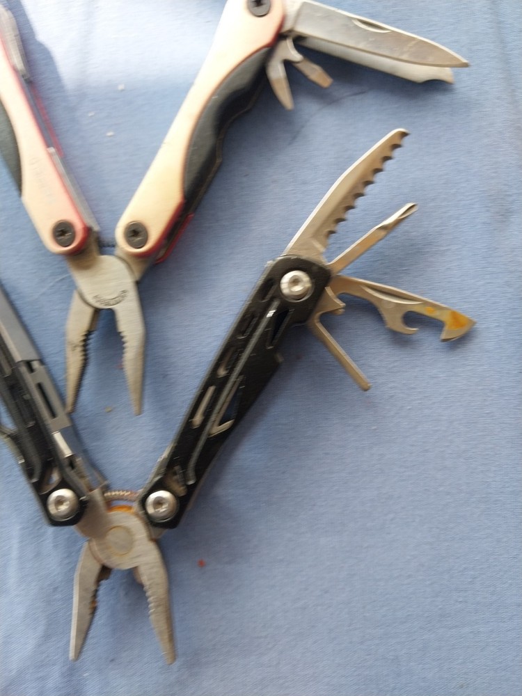 4 small multitudes with pliers knife scissors screwdriver's