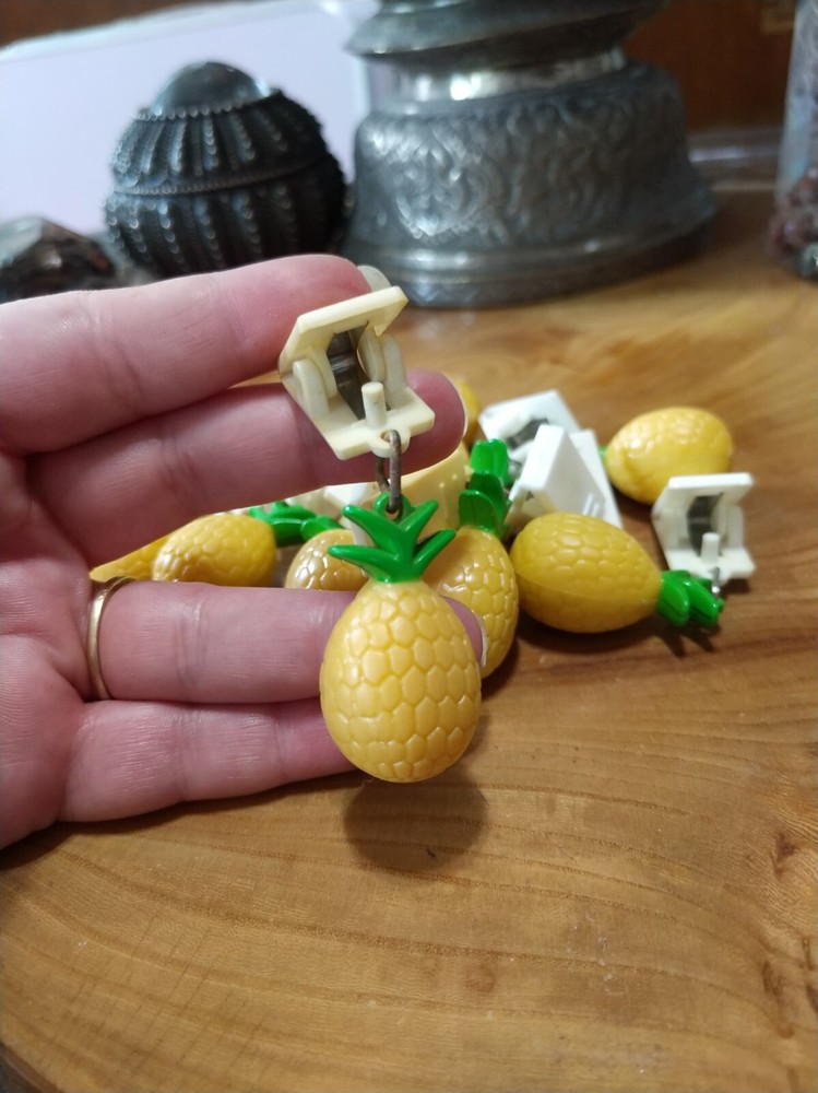 10 plastic pineapple shaped tablecloth weights. picnics, outdoor dining