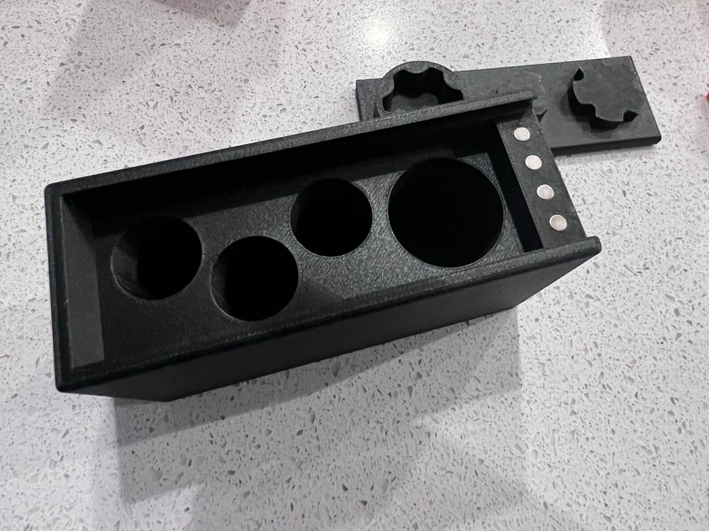 Rugged Obsidian piston/booster storage case and multi-tool