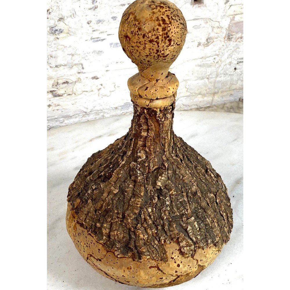 Glass Bottle covered in bark-like cork