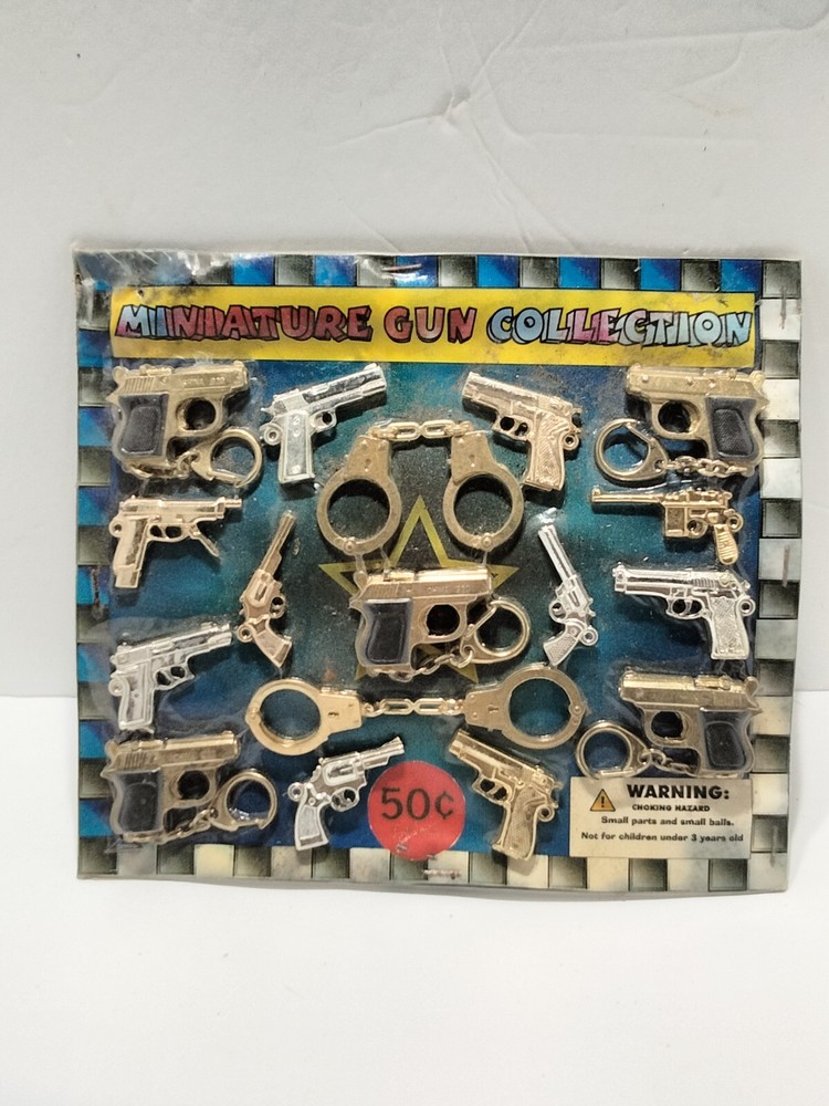 Vending machine display card miniature gun collection