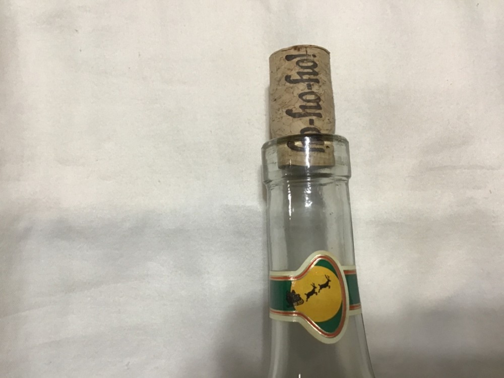 Christmas themed empty Chateau St. Nicholas wine bottle