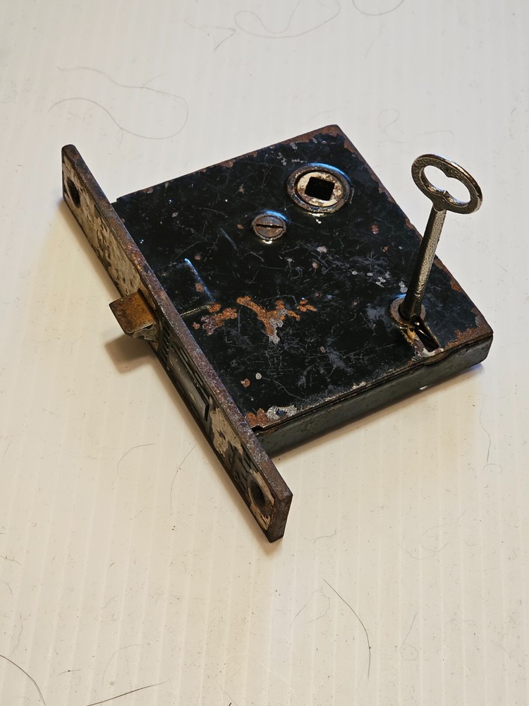 A OLD DOOR LOCK and KEY it WORKS.   E