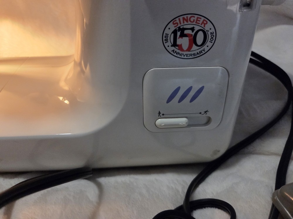 The sewing machine is a Singer, model 2638 Special Editio.