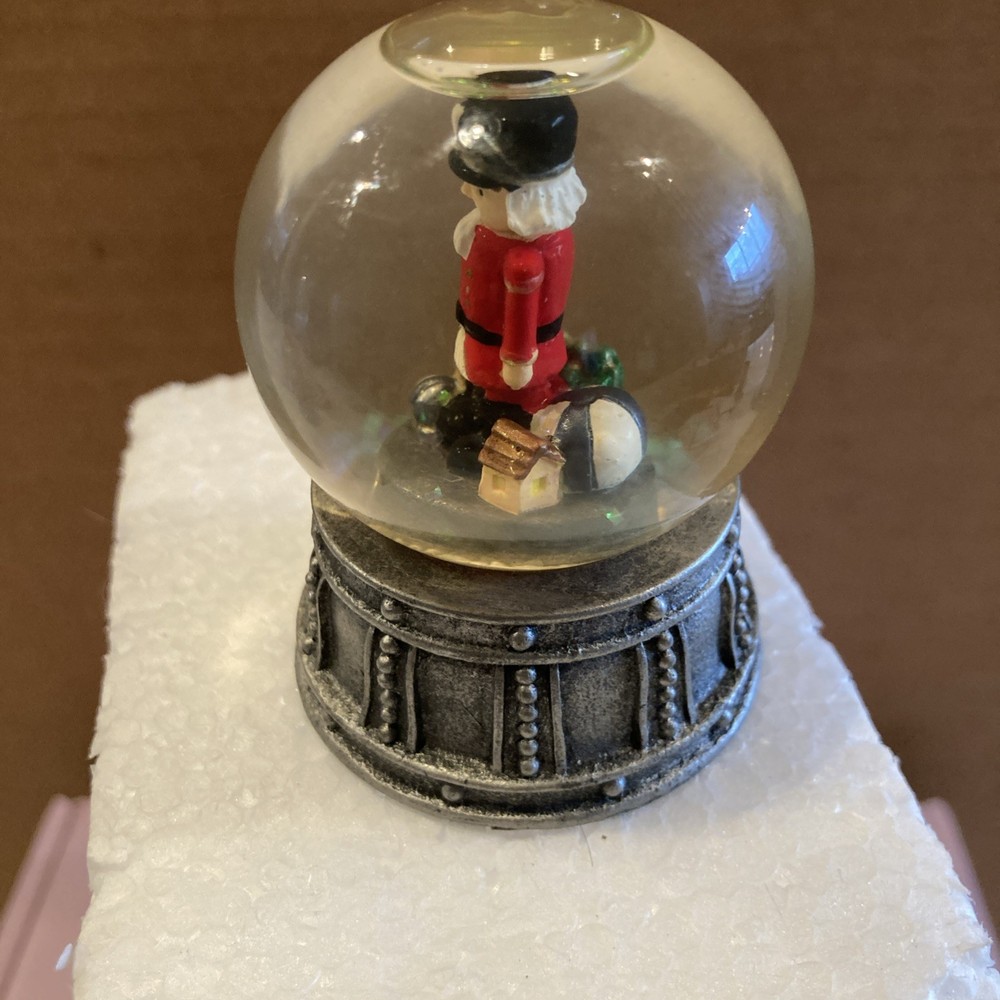 Mini Nutcracker Snow Globe With Metal Base Height 2.5 inches