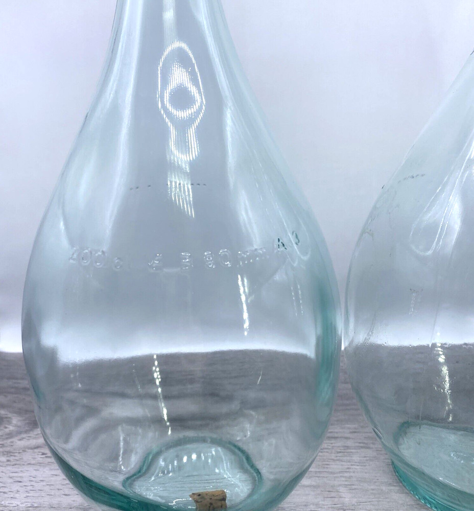 Two old wine bottles - 1 Cork inside - Label Residue