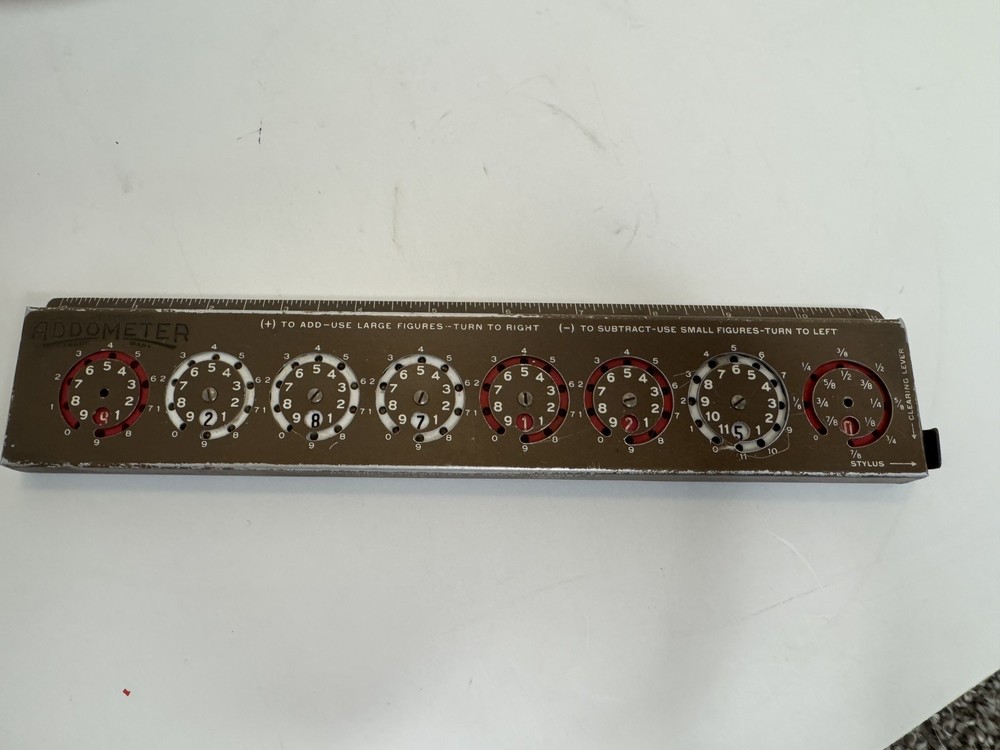 Addometer stylus-operated adding machine. Vintage mechanical calculator.