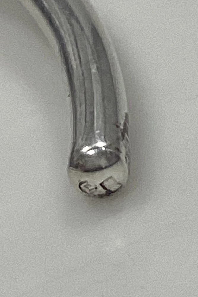 Modern Open Neck Ring in unmarked silver