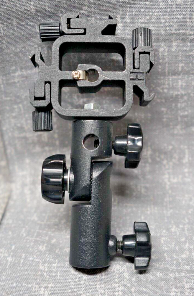 Promaster Triple Shoe Flash Mount Adapter with adjustable light pole mount.