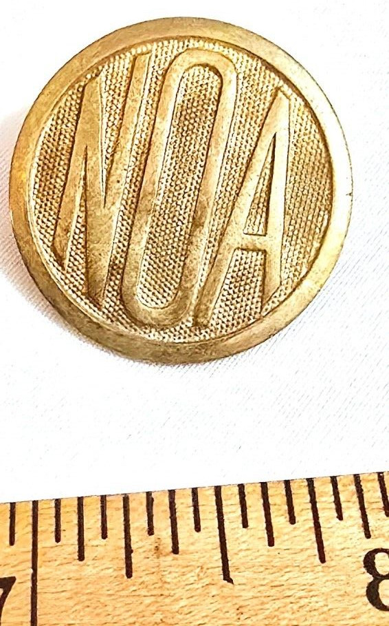 Older Brass Hat Lapel Pin "NOA"