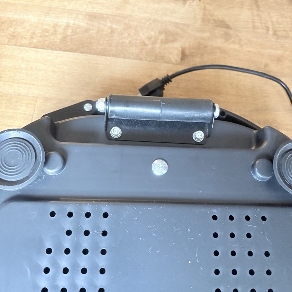 Black Vibration Plate Exercise Machine. Full-Body Vibrating Platform with Resist