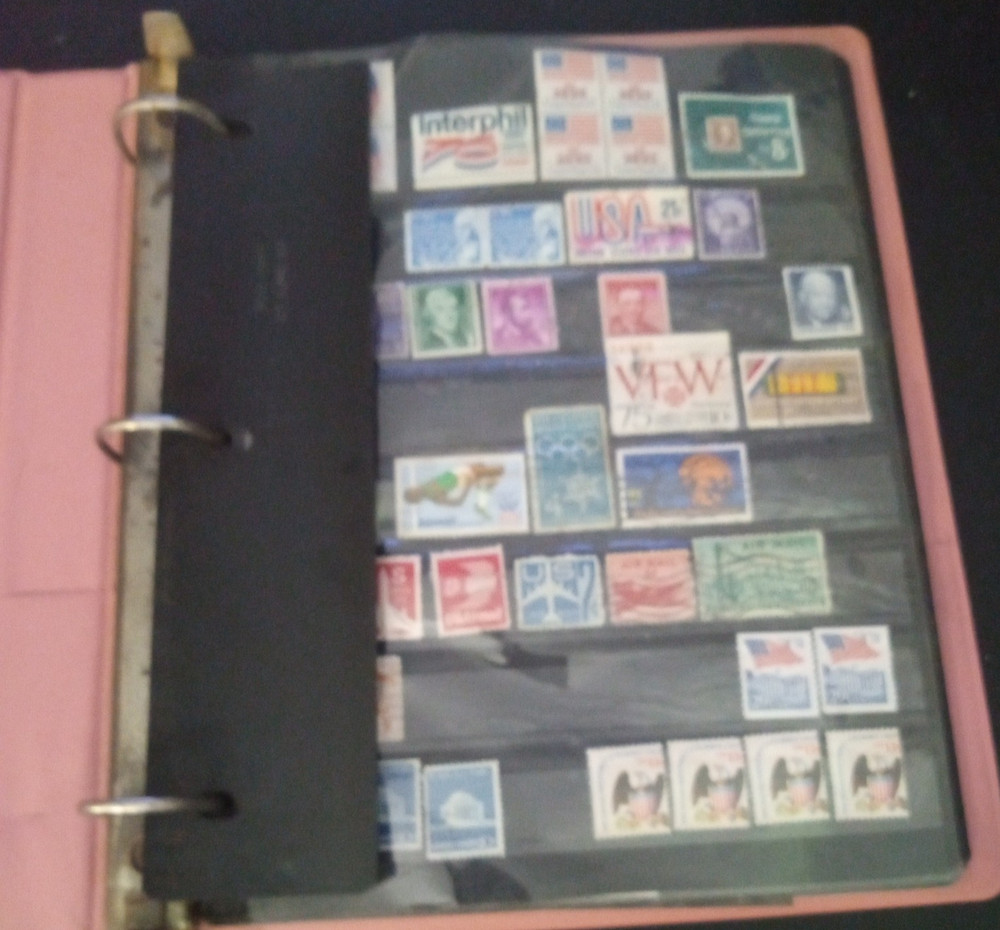 2" 3 ring binder w/ 5 pages of stamps over 100 usable stamps mostly US