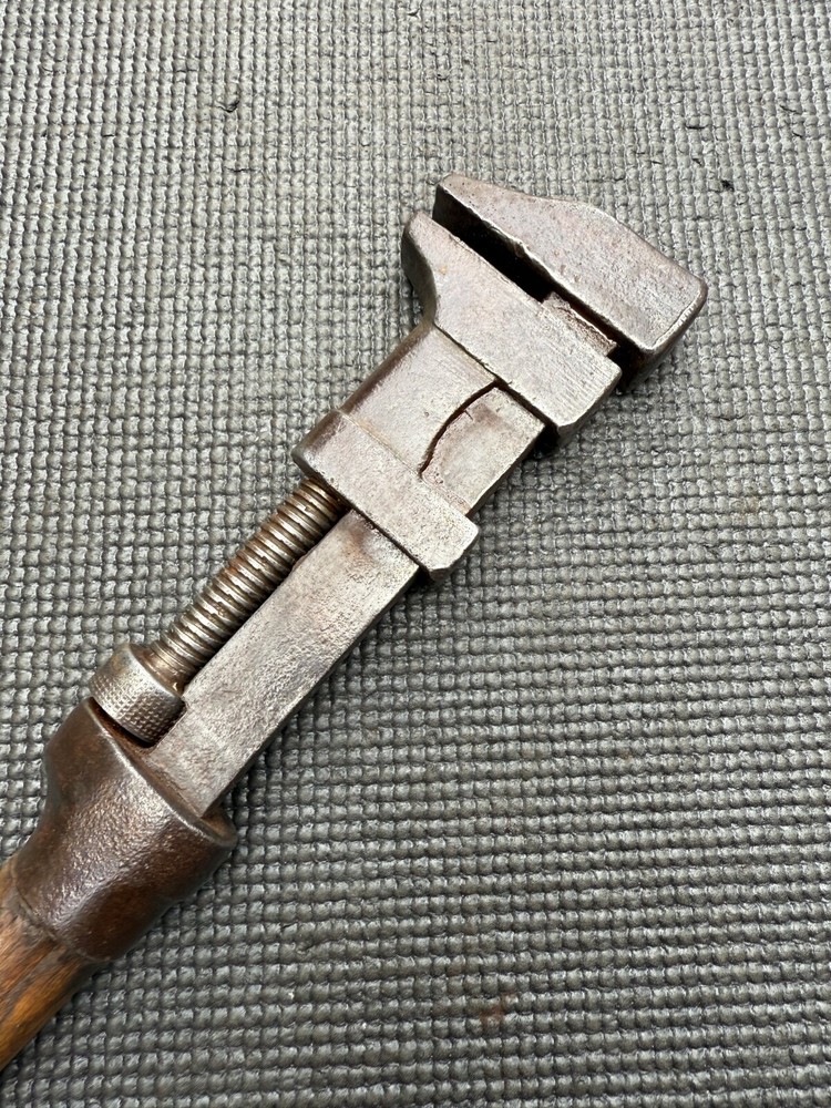 VINTAGE WOODEN HANDLE ADJUSTABLE SPANNER WRENCH.